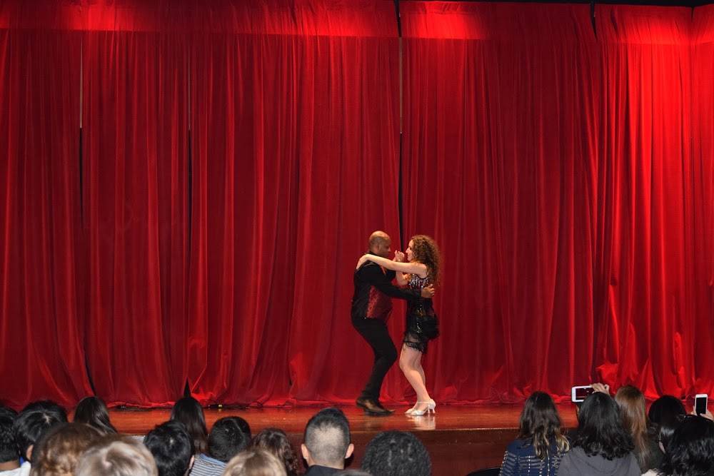 Two people dancing with each other on stage