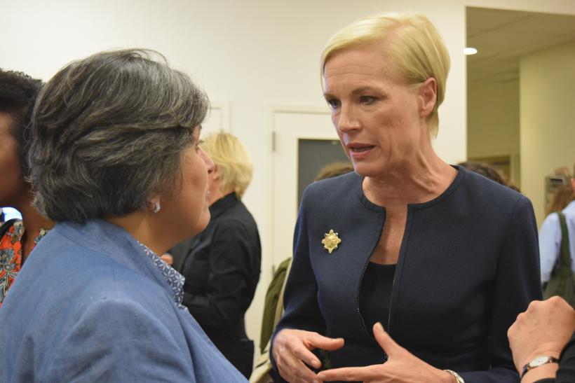 Cecile Richards speaking with guests at the networking reception