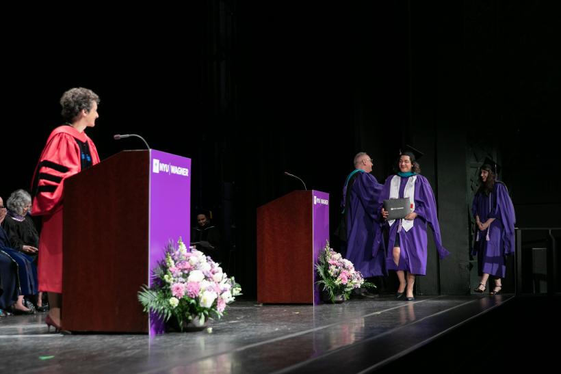 One of the students walks on the stage
