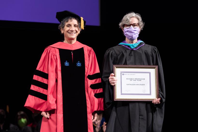 Dean Sherry Glied presenting the Adjunct Professor of the Year award to professor Kathleen Apltauer