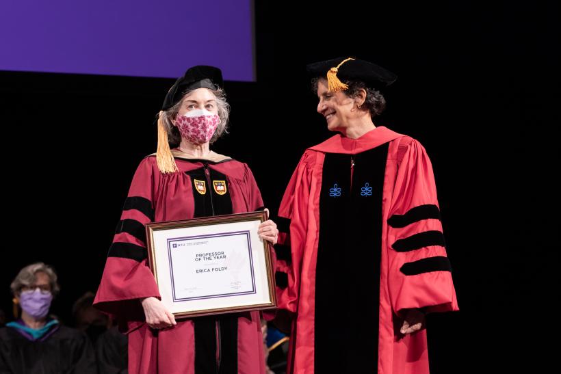 Erica Foldy receiving the Professor of the Year Award with Dean Sherry Glied