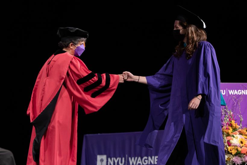 Graduate being greeted by Dean Sherry Glied
