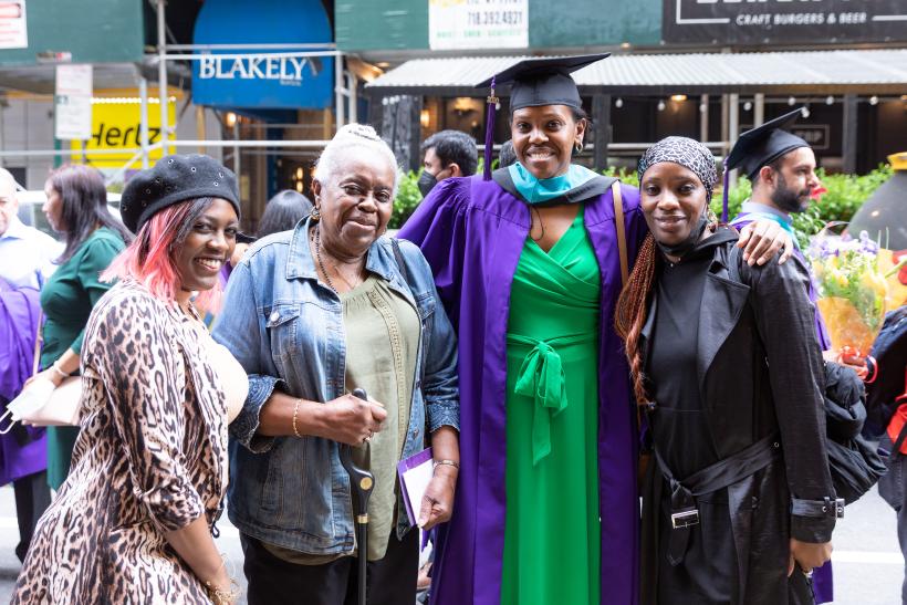 A graduate and family members outside City Center