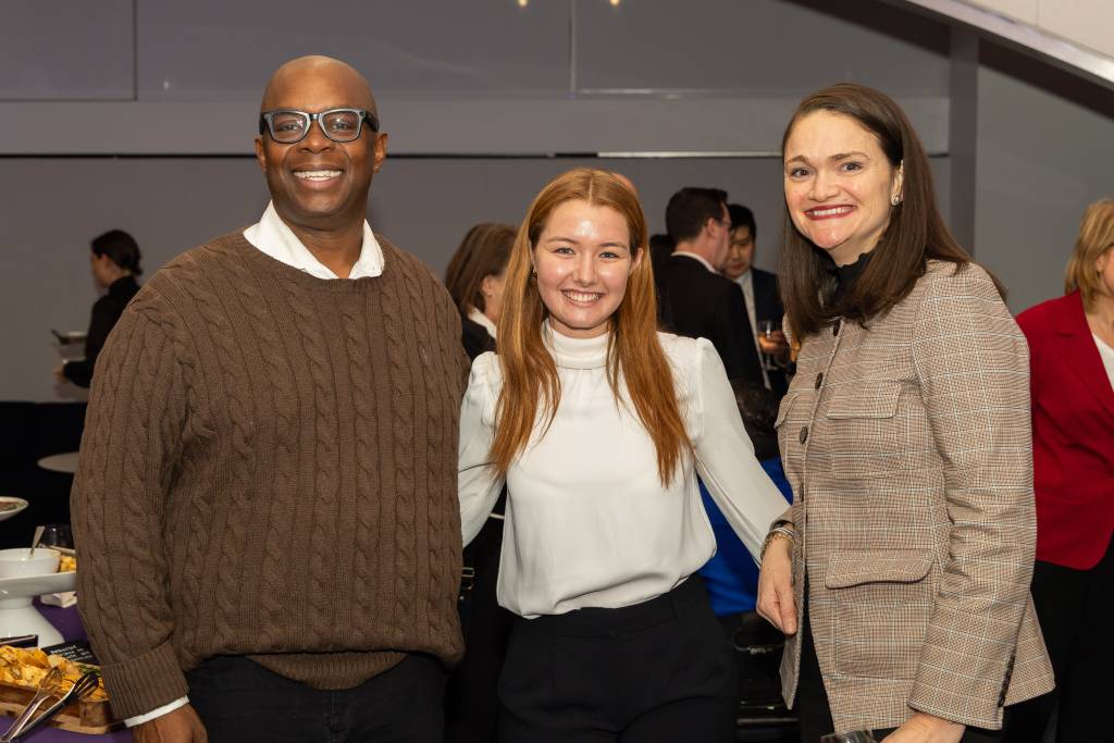 three people posing for photo