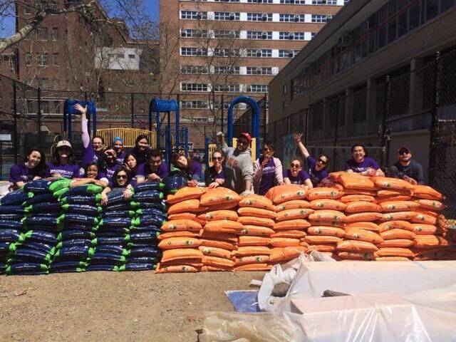 Students with bags of soil