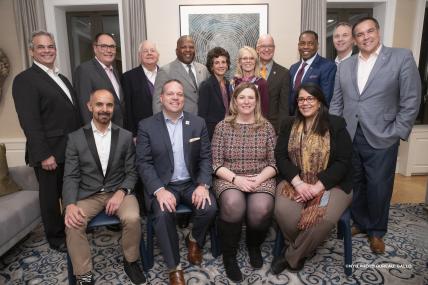 NYU President Hamilton, his wife Jennifer, and Wagner Dean Sherry Glied pictured with the 2018 NYU Wagner-USCM Institute for Mayors participants  