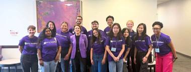 group of students in purple shirts