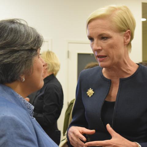 Cecile Richards speaking with guests at the networking reception